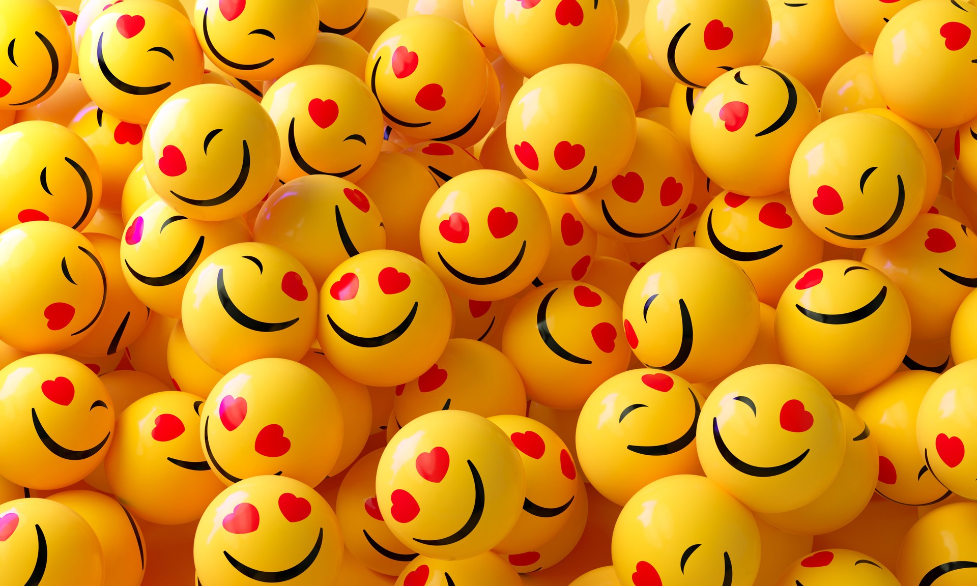 Yellow Spheres Textured With Happy Face Emoji On Yellow Background